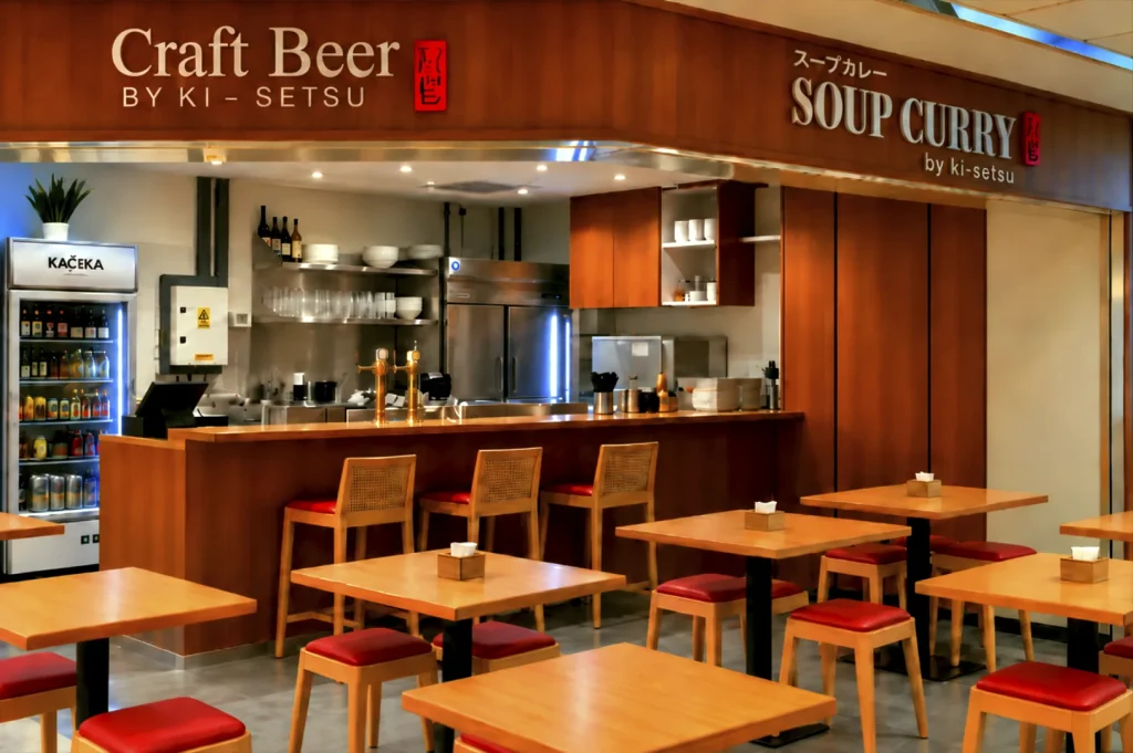 Warmly lit, empty dining room and bar counter setup at Craft Beer by Ki-setsu ready for service at Fortune Centre.